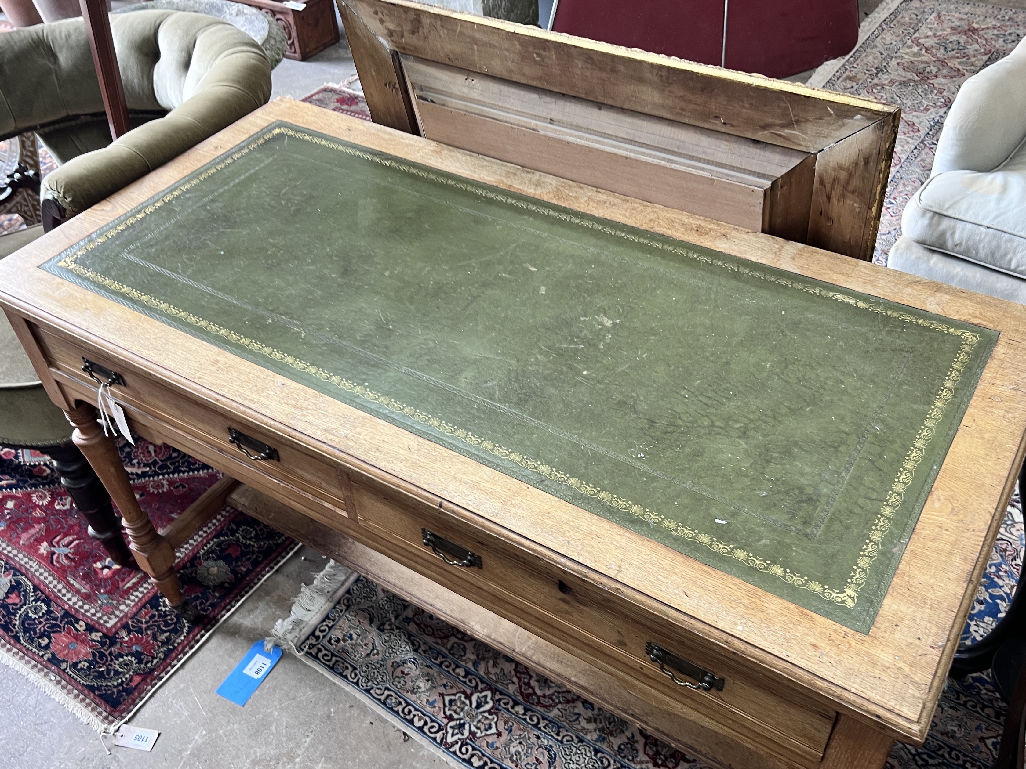 A late Victorian light oak two drawer writing table, width 120cm, depth 59cm, height 78cm